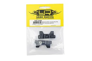 Yeah Racing black aluminium rear lower suspension arm mounts for Team Associated RC10 in original yellow and white retail packaging.