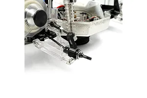 A close-up of a black aluminium rear hub installed on an RC car chassis, featuring the Yeah Racing logo.