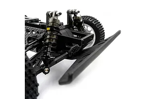 Close-up of the front suspension and chassis of an RC buggy, featuring graphite shock towers, metal oil-filled shocks, and a black plastic front bumper.