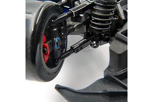Close-up of a black Yeah Racing aluminium front lower suspension arm installed on an RC car chassis.