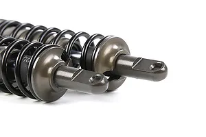 Close-up of two gunmetal-coloured adjustable RC shock absorbers with black springs against a white background.