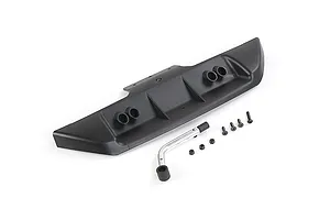 A black plastic rear bumper for an RC car with four exhaust pipe details, accompanied by a metal support bar, screws, and nuts on a white background.