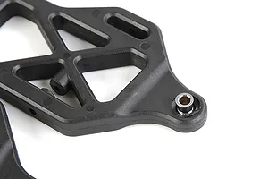 Close-up of a black plastic RC front lower suspension arm with a metal pivot ball insert, set against a white background.