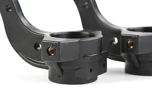Close-up of two black Rovan RC steering hubs showing mounting points and threaded metal inserts against a white background.