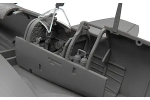 Close-up of the detailed cockpit interior of an unpainted 1/48 scale Supermarine Spitfire plastic model kit.