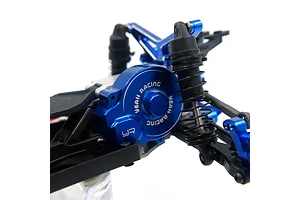 Close-up of a dark blue anodized aluminium motor plate and gear cover installed on an RC car chassis, featuring the Yeah Racing logo.