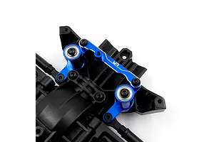 Close-up of a blue anodized aluminium steering bell crank assembly installed on a black plastic RC chassis component.