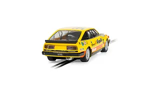 Rear three-quarter view of a yellow Scalextric 1/32 scale Rover SD1 Vitesse slot car with racing decals on a track.