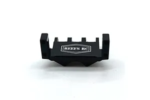 A black aluminium Reefs RC servo mount for RC vehicles, featuring a laser-etched logo on a white background.
