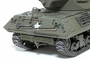 Close-up of the rear hull of a Tamiya 1/35 scale M36 U.S. Tank Destroyer model, showing detailed tools, tracks, and a white star decal.