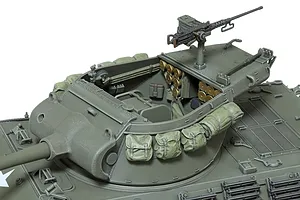 A high-angle view of a Tamiya 1/35 scale M36 tank destroyer model, showing the open turret interior, machine gun, and external stowage bags.