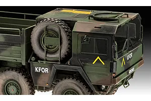 A detailed close-up of a 1/35 scale Revell MAN 10T Milgl 8x8 military truck model, featuring camouflage paint, KFOR markings, and a spare tire.