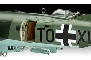 Close-up of a 1/72 scale Focke-Wulf Fw 200 model aircraft showing the fuselage, open side door, and dorsal gun turret.