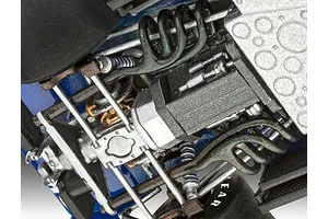 Close-up view of the detailed engine and suspension assembly of a Revell 1/32 Tyrrell P34/2 model car kit.