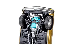 Underside view of a 1/24 scale model 1964 Pontiac GTO showing the chassis, suspension, and turquoise engine block.