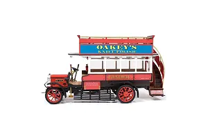 A side-view of a completed OcCre 1/24 scale AEC B-Type bus wooden model kit, featuring red and white paint with Oakey's Knife Polish advertising signage.