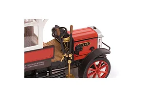 Close-up of the driver's cabin and front wheel of an OcCre 1/24 scale AEC B-Type bus model, featuring red, black, and wooden details.