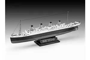 A completed plastic model of the RMS Titanic on a black display stand against a grey gradient background.