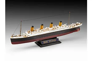 A finished plastic model of the RMS Titanic on a black display stand against a gradient grey background.