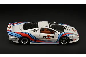 A side-profile view of a 1/24 scale model Jaguar XJ 220 race car with Martini racing livery on a black background.