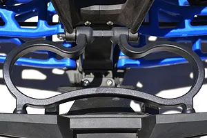 Close-up of an RPM rear bumper mount installed on an RC vehicle chassis, featuring a black plastic guard with the RPM logo.