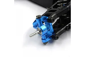 A blue anodized aluminium steering hub installed on an RC car suspension arm, featuring the Yeah Racing logo.