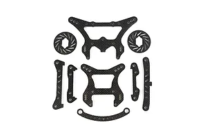 A set of Rovan carbon fibre RC car parts including shock towers, braces, and brake discs laid out on a white background.