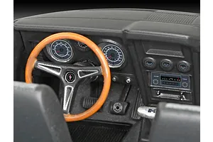 Close-up of the detailed interior of a 1/25 scale 1971 Ford Mustang Boss 351 model car, showing the dashboard, steering wheel, and gauges.