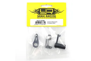 Yeah Racing KYUT-007BK black aluminium steering arm set for Kyosho Ultima in original yellow and clear plastic retail packaging.