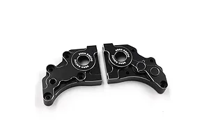 Two black anodized aluminium gearbox case halves for an RC car, featuring the Yeah Racing logo laser-etched around the central bearing holes.