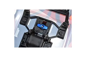 A blue aluminium body shell lock installed on a black plastic RC car body mount structure.