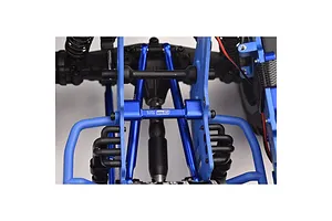 A close-up view of a blue aluminium centre brace bar installed on an RC vehicle chassis, featuring the GPM Racing logo.