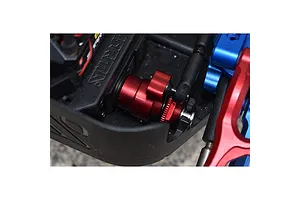 A red anodized aluminium servo horn with integrated servo saver installed in an Arrma RC vehicle chassis.