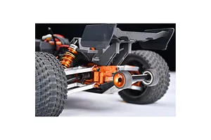 Close-up of an orange GPM Racing wheelie bar installed on the rear of an RC vehicle, featuring metallic orange components and two small rubber wheels.