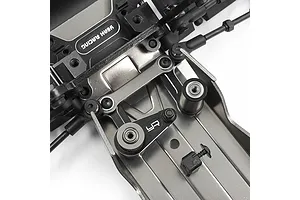 Close-up of a black and silver aluminium RC car chassis conversion kit installed on a vehicle frame.