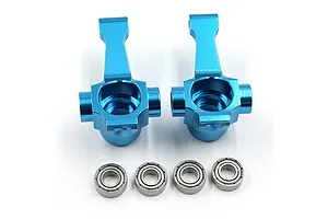Two bright blue anodized aluminium RC front steering hubs with four small metal ball bearings arranged in a row below them on a white background.