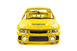 Front view of a yellow 1/10 scale Mitsubishi Lancer Evo IV RC car body shell with detailed headlights, grille, and windshield wipers.