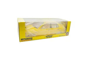 A yellow 1/10 scale Mitsubishi Lancer Evolution IV RC body shell by Yeah Racing, packaged in a yellow cardboard box with a clear plastic window.