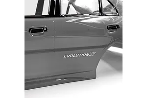Close-up of the side panel of a silver painted RC Mitsubishi Lancer Evolution IV body shell, showing the Evolution IV decal.