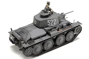 A fully assembled and painted 1/48 scale Tamiya German Panzer 38(t) model tank with a crew figure in the turret, viewed from a high rear angle.