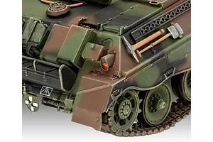 Close-up of the rear section of a camouflaged Raketenjagdpanzer Jaguar 1 plastic model tank showing tools and tracks.