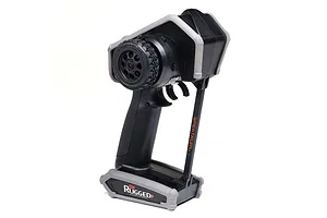 Spektrum DX Rugged+ 12-channel RC transmitter with a black and grey protective chassis, shown from a side angle against a white background.
