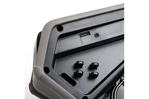 Close-up of the base of a Spektrum DX Rugged transmitter showing the USB-C charging port and rubberized protective bumper.