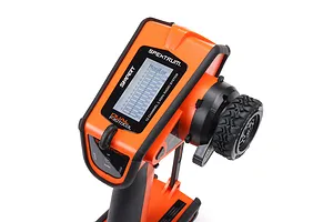 Spektrum DX Rugged 12-channel RC transmitter in orange and black, featuring a steering wheel and digital display screen.