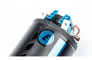 Close-up of the end bell of an LRP Blue E 540 brushed RC motor, showing the blue anodized cooling fins and electrical terminals.