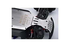A stainless steel integrated chassis skid plate installed on an ARRMA Kraton EXB RC vehicle, showing the metal plate with branding.