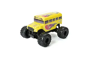 A yellow Pro-Line RC school bus body shell mounted on a 1/16 scale monster truck chassis with black off-road tires.