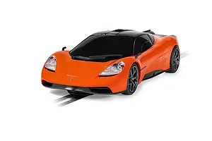 A bright orange Scalextric 1/32 scale GMA T.50 slot car on a track against a white background.
