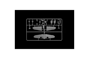 A grey plastic sprue containing various aircraft model parts, including wing sections and small components, set against a black background.