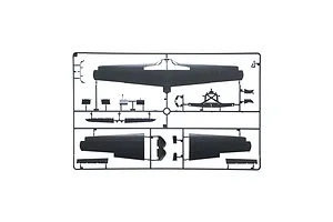 A grey plastic sprue containing various model aircraft parts, including wings and internal structural components for a 1/32 scale model kit.